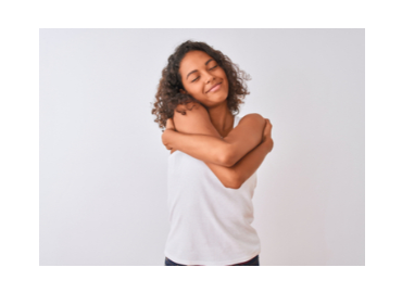 teen giving self hug