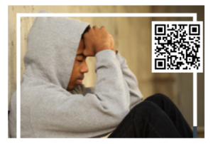 young man with head in hands and a qr code