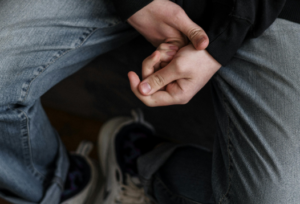 A photo of a person clenching the hands